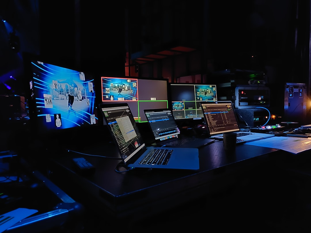 black-and-silver-laptop-computer-on-black-table-vqnpkqnkc0m